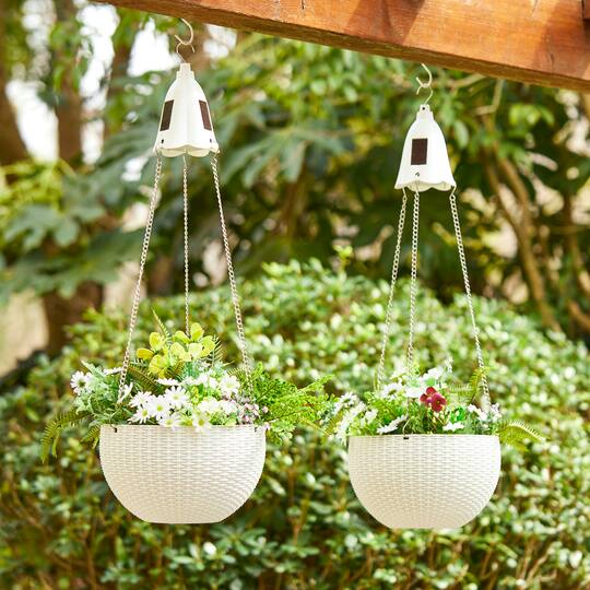 Glitzhome® 30" White Solar Lighted Hanging Plastic Basket Planters, 2ct.